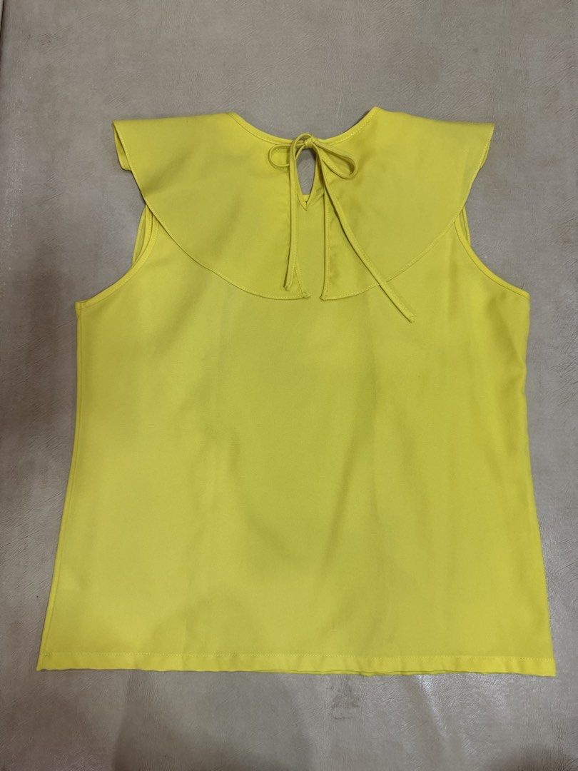 Plains & Prints Yellow Sleeveless Blouse with Ruffles (Category: Blouses) located in Manila. Submitted by abigailyao21949 (Listing ID 1463385688, Image 2). Description: Plains & Prints Yellow Sleeveless Blouse with Ruffles •Size: M •Color: Yellow •Style: Sleeveless with ruffles in front •Slightly used but still in very good condition.