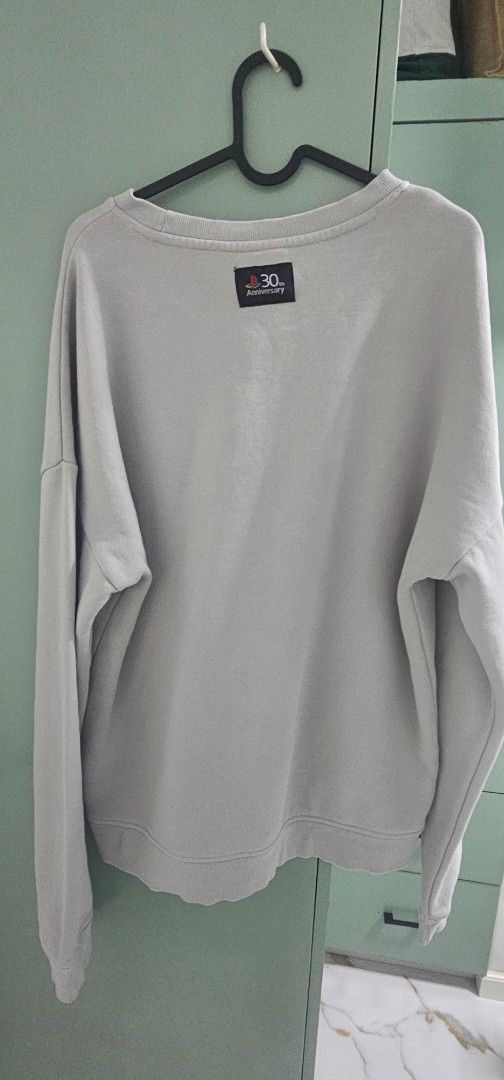 PlayStation 30th Anniversary Grey Sweatshirt Size L (Category: Coats, Jackets and Outerwear) located in Navotas City. Submitted by walburst (Listing ID 1463464441, Image 2). Description: Limited Edition 30th Anniversary Commemorative Sweatshirt Official Playstation Merch Large Excellent condition *can only be obtained through Playstation Loyalty Points.