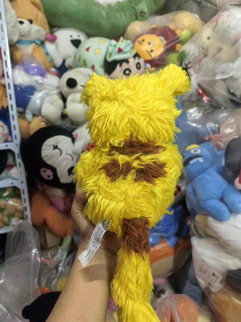Pokemon Pikachu Plush Toy (Category: Plushies & Soft Toys) located in Paranaque City. Submitted by furugiyafinds (Listing ID 1463396460, Image 2). Description: - Adorable yellow Pikachu plush toy - Features brown accents on back and tail - Made with soft and fluffy material - Ideal for any Pokemon fan - Perfect for display or cuddling - A great addition to any collection.