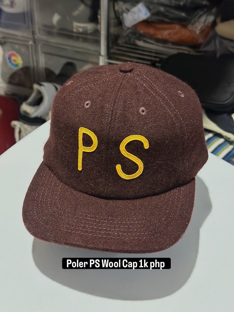 Poler PS Wool Cap (Category: Caps & Hats) located in Daet. Submitted by thrifthings2018 (Listing ID 1463429504, Image 1). Description: - Brown wool cap - Yellow 'PS' embroidery - Adjustable strap for a comfortable fit - Ideal for everyday wear.