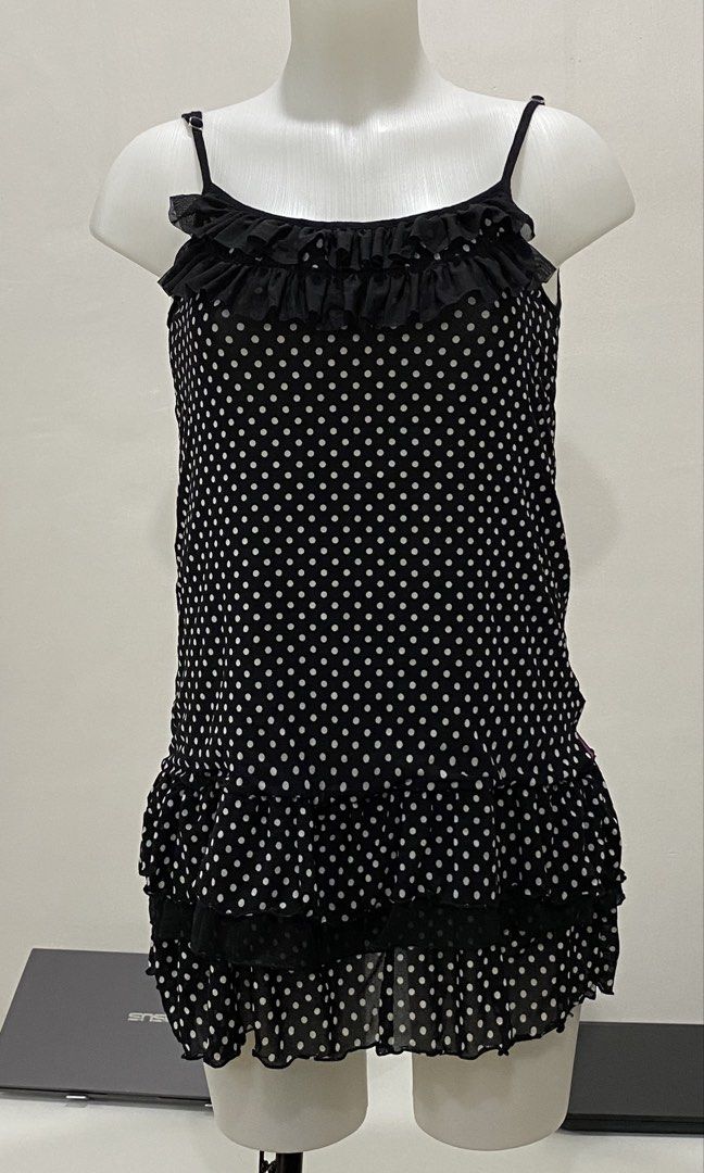 Polka Dot Ruffled Dress - PL-004 (Category: Dresses) located in Quezon City. Submitted by luckyphoenix.7 (Listing ID 1463399162, Image 1). Description: - Cute black dress with white polka dots - Features ruffles at neckline and hem - Spaghetti straps - Estimated size: S-M - Versatile for casual outings or nights out.