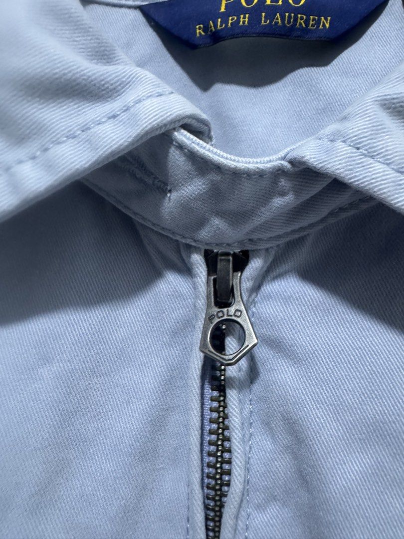 Polo Ralph Lauren Light Blue Harrington Jacket M/M (Category: Coats, Jackets and Outerwear) located in Manila. Submitted by esparciake75752 (Listing ID 1463354694, Image 3). Description: - Light blue Polo Ralph Lauren jacket - Classic Harrington style - Iconic polo player logo on chest - Zipper closure with branded pull tab - Size Medium / 21x26 - Made in China.
