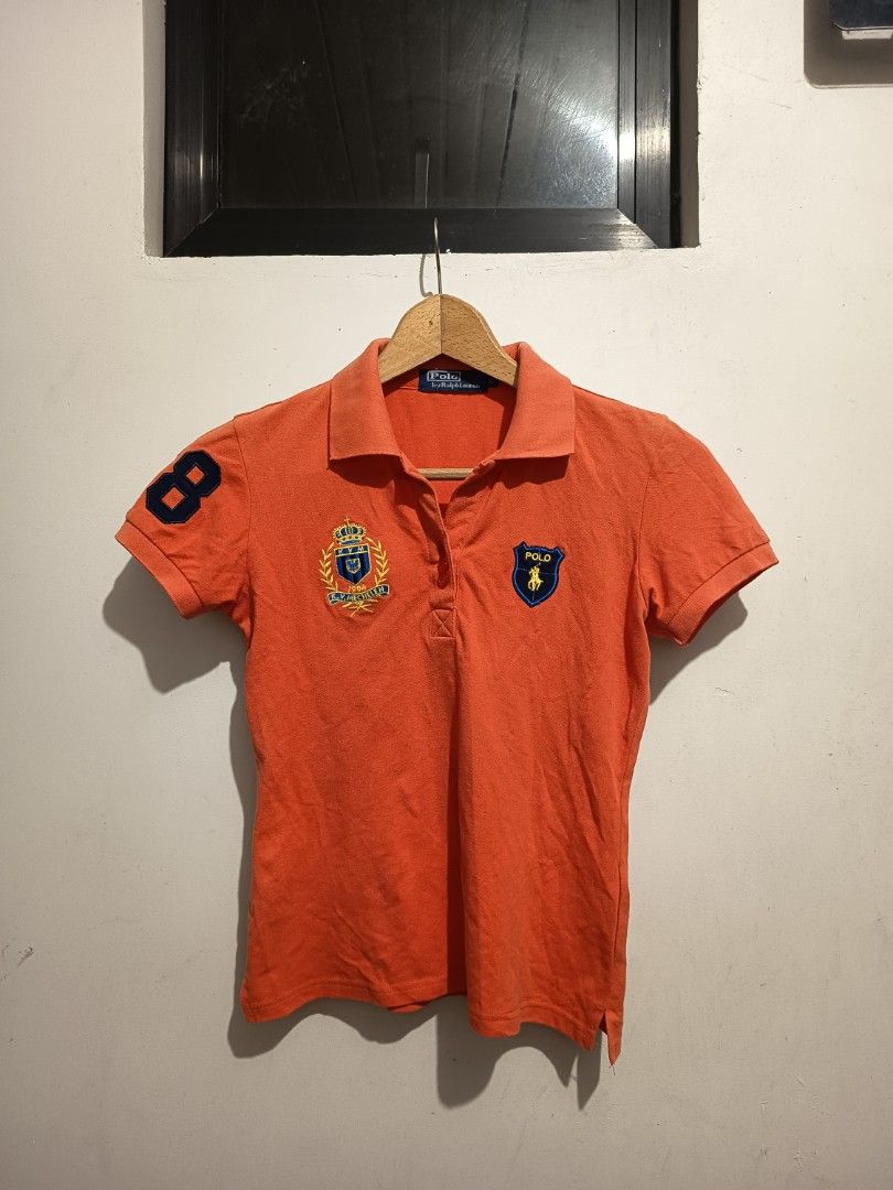 Polo Ralph Lauren Pink & Orange (2 pcs) (Category: Activewear) located in Bulacan. Submitted by dvsthrift (Listing ID 1463526440, Image 2). Description: - Authentic Polo Ralph Lauren polo shirts - Bright pink polo with green '2' graphic on sleeve and horse/rider graphic on front - Orange polo with navy blue '8' graphic on sleeve and two crests on front - Both are short-sleeved with classic button plackets - Perfect for stylish playdates and every