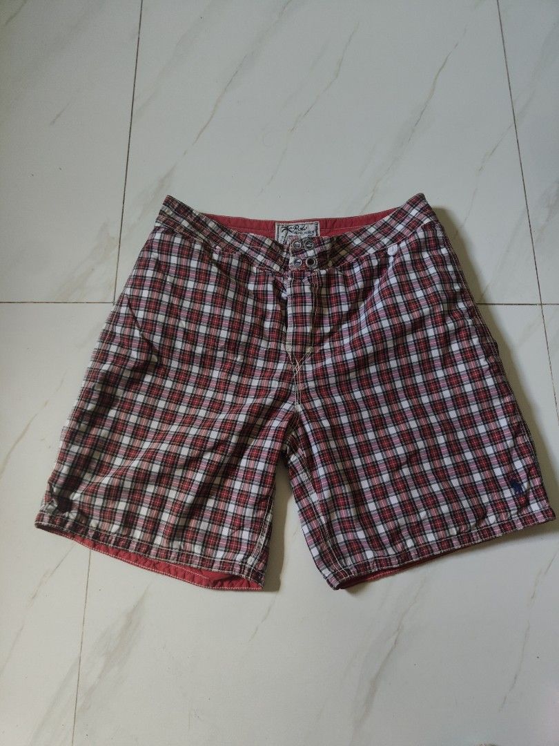 Polo Ralph reversible swim shorts (Category: Swim Trunks & Board Shorts) located in Legazpi City. Submitted by luckytree_09199b (Listing ID 1463358072, Image 3). Description: - Polo Ralph Lauren swim trunks - Reversible design: Red with white stripes on one side, plaid on the other - Elastic waistband with drawstring for adjustable fit - Button closure at the fly - Convenient side pockets - Ideal for beach or pool outings - Ready for summer fun!.