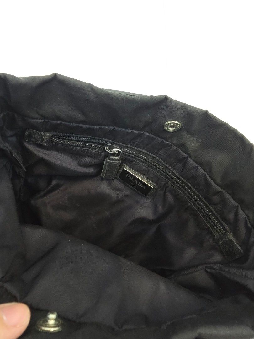 Prada Black Nylon Messenger Sling Bag (Category: Luxury Bags & Wallets) located in Las Pinas. Submitted by vanpru (Listing ID 1463433589, Image 3). Description: - Authentic Prada bag - Black nylon material - Iconic Prada triangle logo - Interior zippered pocket - 'Made in Italy' tag - Adjustable strap - Ideal for everyday use - Decluttering. bought from Japan. rarely used..