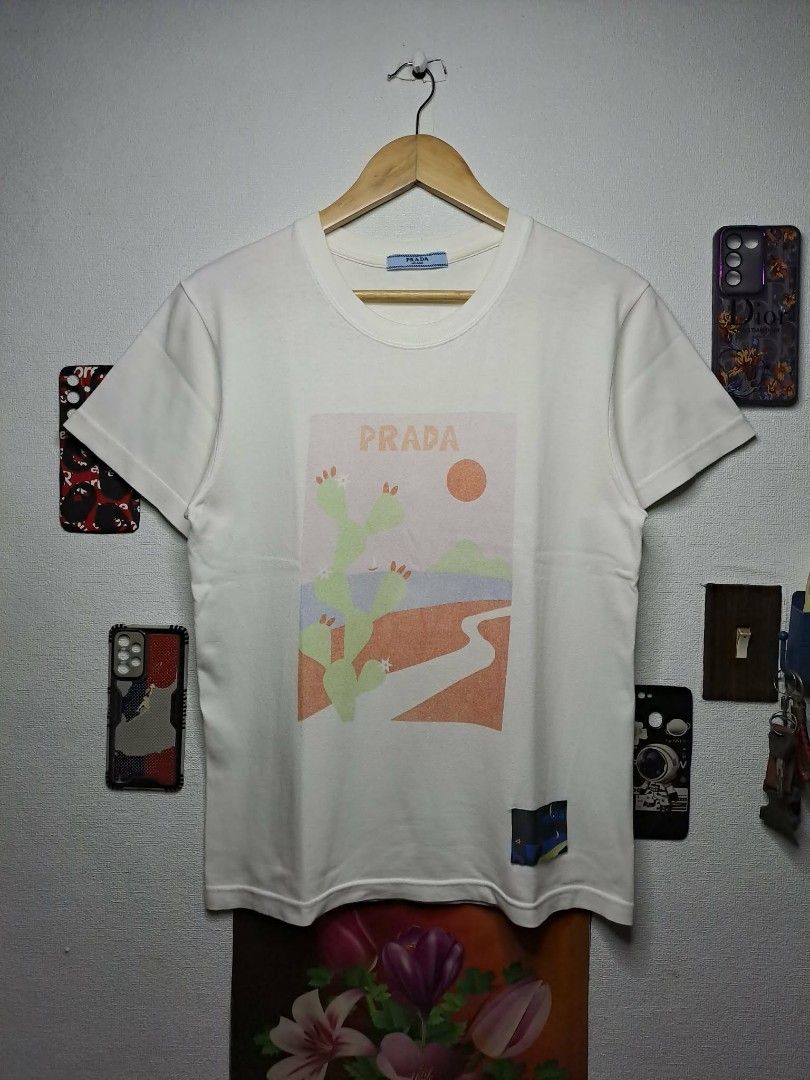 Prada Castus Desert 2018 (Category: Luxury Apparel) located in Manila. Submitted by yaseen_73 (Listing ID 1463390419, Image 1). Description: Prada Cactus Print T-Shirt from their Spring/Summer 2018 collection No Side Stitching Wearing Size : Small - Medium Dimensions : Please Refer to the Photo Color Rate : 9.5/10 No Issue Needs Re - Wash In Excellent Condition or Best Offer MOP : G C A S H B A N K T R A N S F E R Courier : J&T Lalamove Seller's 