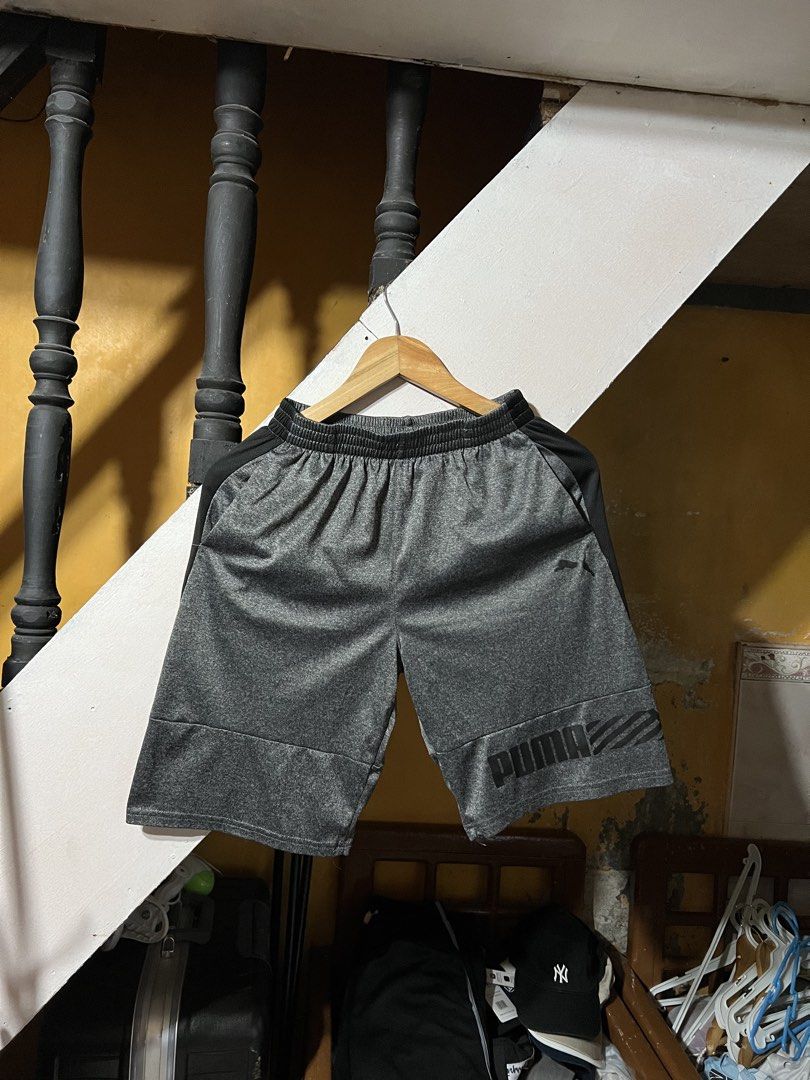 Puma Athletic Shorts Grey Men's Size L (Category: Shorts) located in Butuan. Submitted by nikthrift. (Listing ID 1463336120, Image 1). Description: - Grey Puma athletic shorts - Elastic waistband with drawstring - Side pockets - Puma logo on left leg - Ideal for sports or casual wear - Made in Egypt.