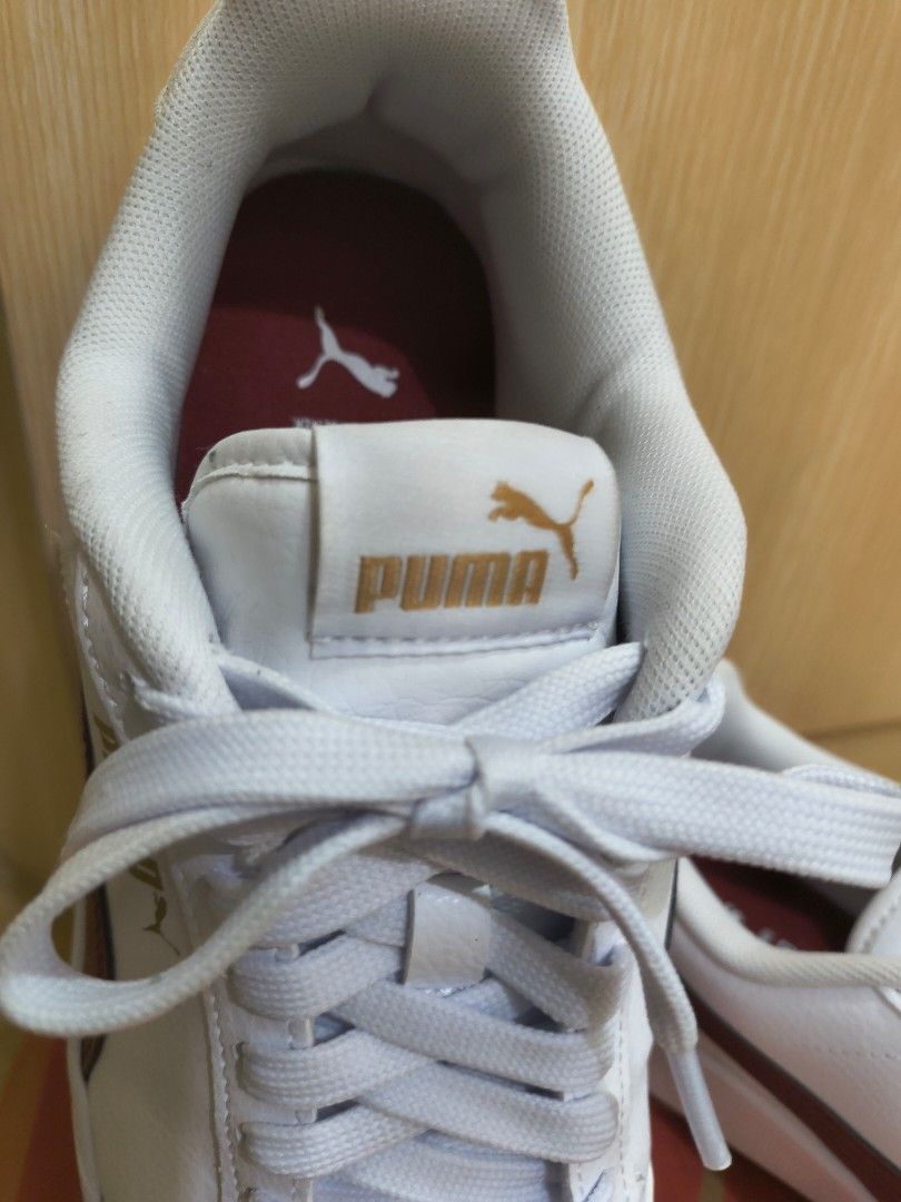 Puma Shuffle White-Intense Red-Gold Sneakers (Category: Sneakers) located in Manila. Submitted by hakunaematata (Listing ID 1463356683, Image 2). Description: - Puma Shuffle sneakers - Color: White with intense red-gold accents - Size: US 7 (UK 6, EUR 39, CM 25) - Made in Indonesia - Condition: Clean and ready for a new owner - Perfect for casual wear.