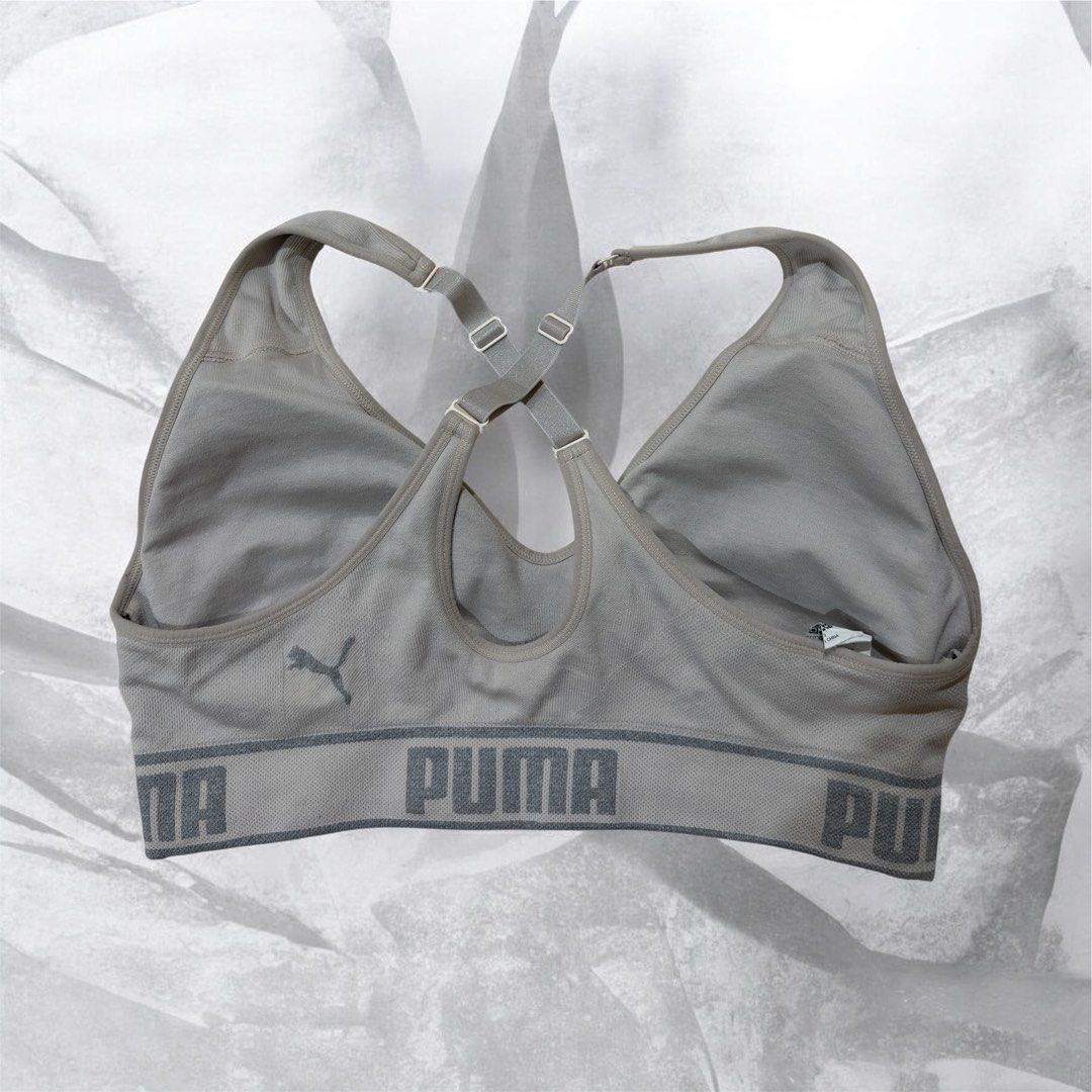 Puma Sports Bra - Grey & Black (Category: Activewear) located in Muntinlupa City. Submitted by affordableonlinestuff (Listing ID 1463479679, Image 2). Description: -Puma Sports Bras (Grey & Black) - Classic Puma logo band at the bottom - Adjustable straps for a custom fit - Straps can be worn crossed at the back for added support or style - Ideal for workouts, gym sessions, or comfortable lounging - Provides excellent comfort and support.