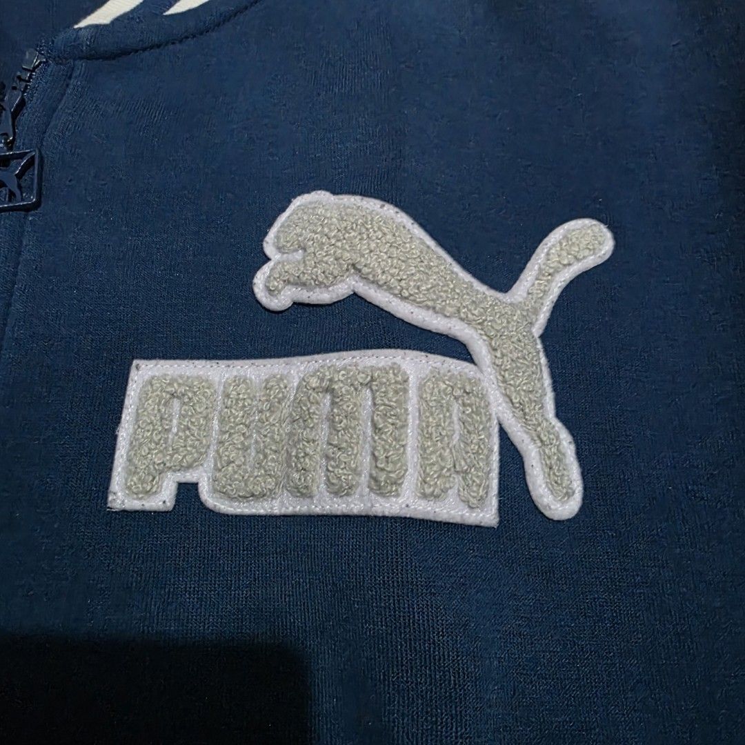 Puma Varsity Jacket Blue White (Category: Coats, Jackets and Outerwear) located in Quezon City. Submitted by kick_mnl (Listing ID 1463374267, Image 2). Description: - Classic Puma varsity jacket - Blue body with contrasting white sleeves - Features embroidered Puma logo and patches - Ribbed cuffs and hem for a comfortable fit - Full zipper closure - Ideal for everyday casual wear.