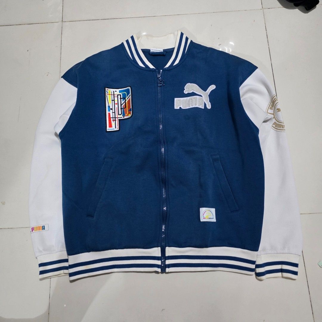 Puma Varsity Jacket Blue White (Category: Coats, Jackets and Outerwear) located in Quezon City. Submitted by kick_mnl (Listing ID 1463374267, Image 1). Description: - Classic Puma varsity jacket - Blue body with contrasting white sleeves - Features embroidered Puma logo and patches - Ribbed cuffs and hem for a comfortable fit - Full zipper closure - Ideal for everyday casual wear.