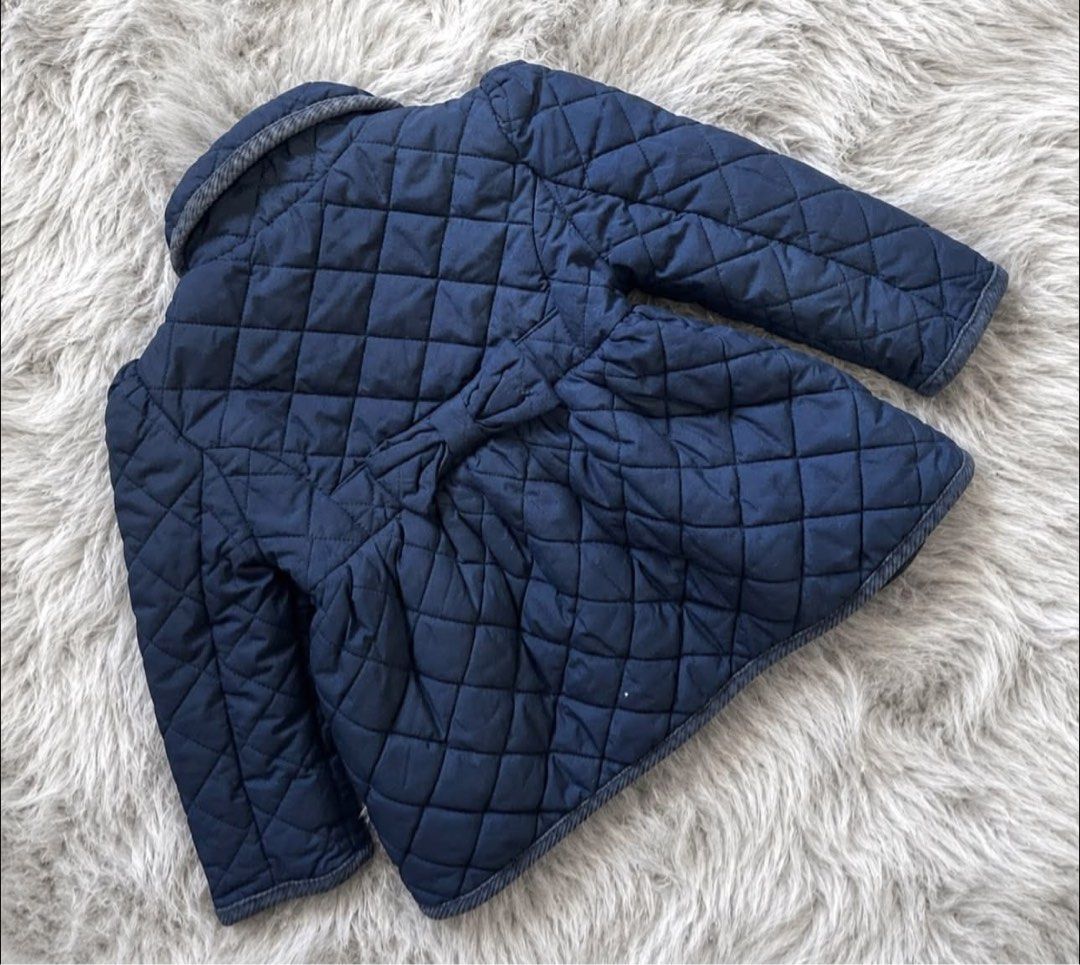 Ralph Lauren Quilted Navy Blue Jacket 24M (Category: Babies & Kids Fashion) located in Manila. Submitted by goldencrystal.1726fa (Listing ID 1463455554, Image 2). Description: - Navy blue quilted jacket from Ralph Lauren - Features a cute bow detail at the back - Grey herringbone trim on the collar - Button-up front closure - Ideal for cooler weather.