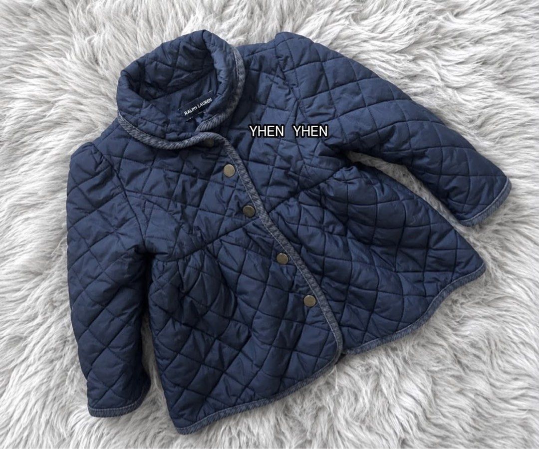 Ralph Lauren Quilted Navy Blue Jacket 24M (Category: Babies & Kids Fashion) located in Manila. Submitted by goldencrystal.1726fa (Listing ID 1463455554, Image 1). Description: - Navy blue quilted jacket from Ralph Lauren - Features a cute bow detail at the back - Grey herringbone trim on the collar - Button-up front closure - Ideal for cooler weather.