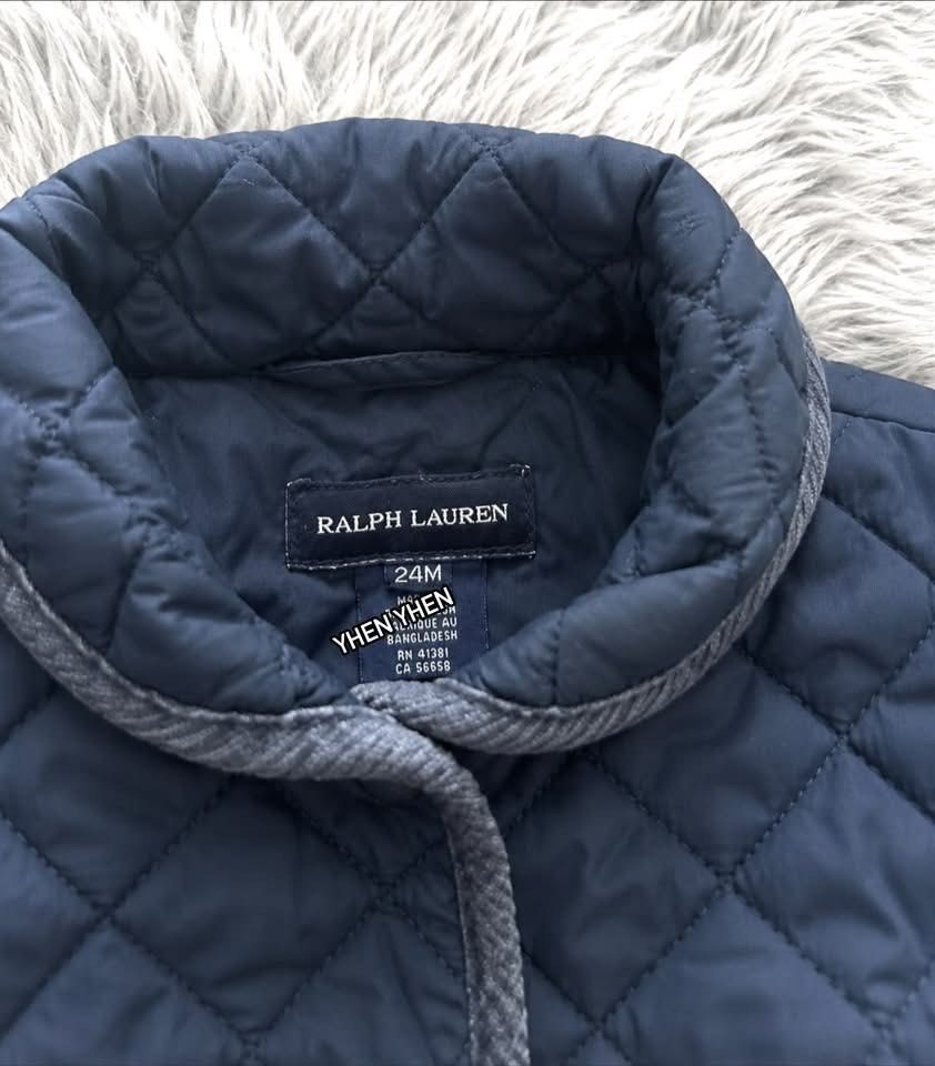 Ralph Lauren Quilted Navy Blue Jacket 24M (Category: Babies & Kids Fashion) located in Manila. Submitted by goldencrystal.1726fa (Listing ID 1463455554, Image 3). Description: - Navy blue quilted jacket from Ralph Lauren - Features a cute bow detail at the back - Grey herringbone trim on the collar - Button-up front closure - Ideal for cooler weather.