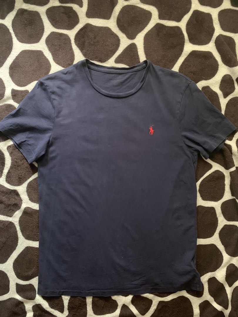 Ralph Lauren Tee (Category: Tshirts & Polo Shirts ) located in Kabacan. Submitted by nevr_outofstyle (Listing ID 1463438235, Image 1). Description: Navy Blue Ralph Lauren Tee Details W- 19” L- 27” issue: neck area (see pic) buyer will shoulder the delivery fee MOP: Gcash 🚚 J&T.