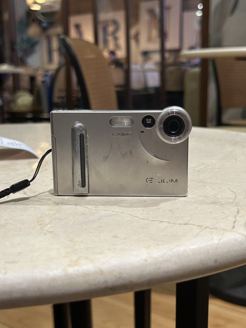 RARE Casio Exilim S2 digicam digital camera (Category: Cameras) located in Lagonoy. Submitted by nadayojiii (Listing ID 1463391375, Image 1). Description: Casio Exilim S2✨ NO FUNCTIONAL ISSUES ALL WORKING all buttons working flash working zoom working rare piece!✨ lcd has mild flaw(output not affected) CARD SIZE🪪✨ super thin!! has a viewfinder✨ COMPLETE SET inclusion: unit battery charger sd card strap stickers.