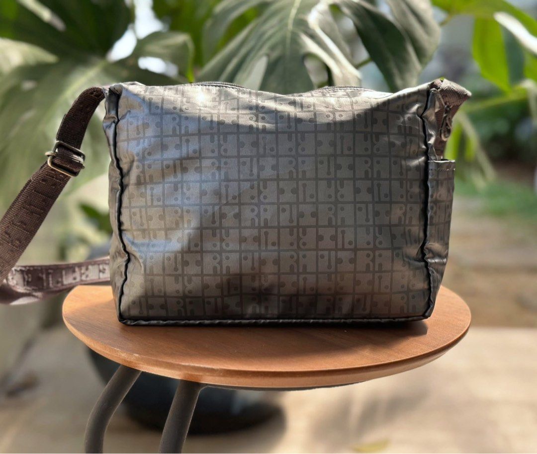 RaviRavi lightweight gray crossbody (Category: Cross-body Bags) located in Bulacan. Submitted by thriftbagcollections (Listing ID 1463400410, Image 3). Description: RaviRavi lightweight gray shoulder bag is a water-repellent, nylon crossbody made in Japan. Approx;H-6.5”W-9”D-3.5”.