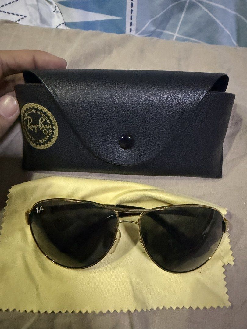 Ray-Ban Aviator Blue Sunglasses with Case (Category: Sunglasses & Eyewear) located in Pasig City. Submitted by aprilluxcloset0812 (Listing ID 1463480243, Image 1). Description: - Classic Ray-Ban Aviator sunglasses - Gold frame with dark lenses - Comes with original black Ray-Ban case - Includes yellow cleaning cloth - Ideal for everyday wear - Stylish eye protection RFS: decluttering EVERYTHING MUST GO‼️Just make a reasonable offer ❤️ All items O
