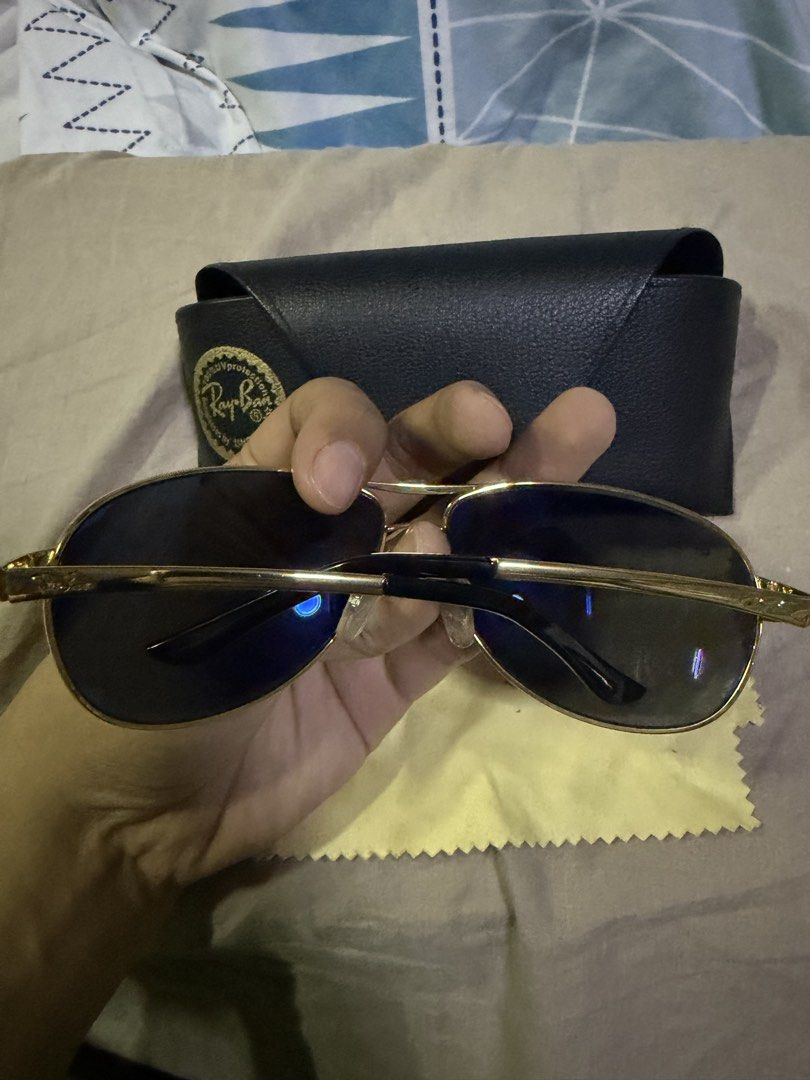 Ray-Ban Aviator Blue Sunglasses with Case (Category: Sunglasses & Eyewear) located in Pasig City. Submitted by aprilluxcloset0812 (Listing ID 1463480243, Image 2). Description: - Classic Ray-Ban Aviator sunglasses - Gold frame with dark lenses - Comes with original black Ray-Ban case - Includes yellow cleaning cloth - Ideal for everyday wear - Stylish eye protection RFS: decluttering EVERYTHING MUST GO‼️Just make a reasonable offer ❤️ All items O
