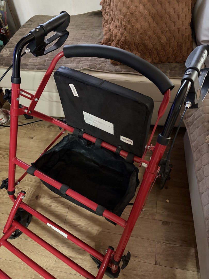 Red Foldable 4-Wheel Walker Rollator with Seat and Bag (Category: Wheelchairs) located in Cavite. Submitted by aubrey223 (Listing ID 1463361707, Image 3). Description: Red walker rollator with a seat and storage bag underneath. Has hand brakes for safety. Wheels make it easy to move around. Folds for storage. Great for mobility assistance. Ready for a new home. bought from Medical Depot in 2025 for 7K .