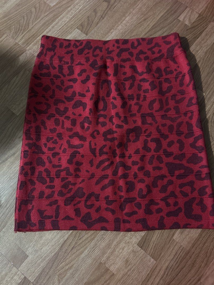 Red Leopard Print Knit Mini Skirt (Category: Skirts) located in Lal-Lo. Submitted by pureearth_8c747c (Listing ID 1463359826, Image 1). Description: - Red mini skirt with a dark red leopard print. - Features a stretchy, ribbed waistband and hem. - Made from a comfortable knit material. - Versatile for both night out and casual wear..
