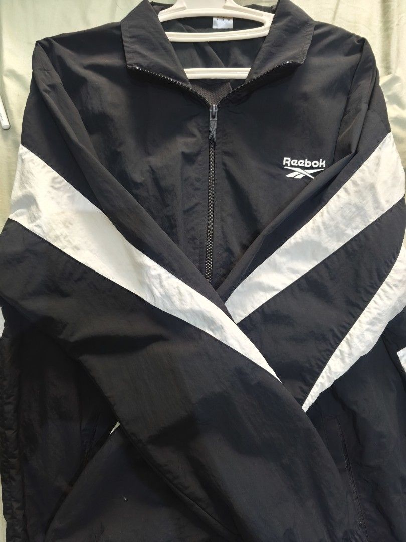 Reebok Track Jacket Windbreaker Blue White (Category: Coats, Jackets and Outerwear) located in Pasig City. Submitted by y2j2oratod (Listing ID 1463451786, Image 1). Description: - Classic Reebok windbreaker jacket - Bright blue with white stripe details on sleeves - Full zip front with collar - Elasticated cuffs and hem - Ideal for casual wear or sports - Lightweight and packable for on-the-go convenience.