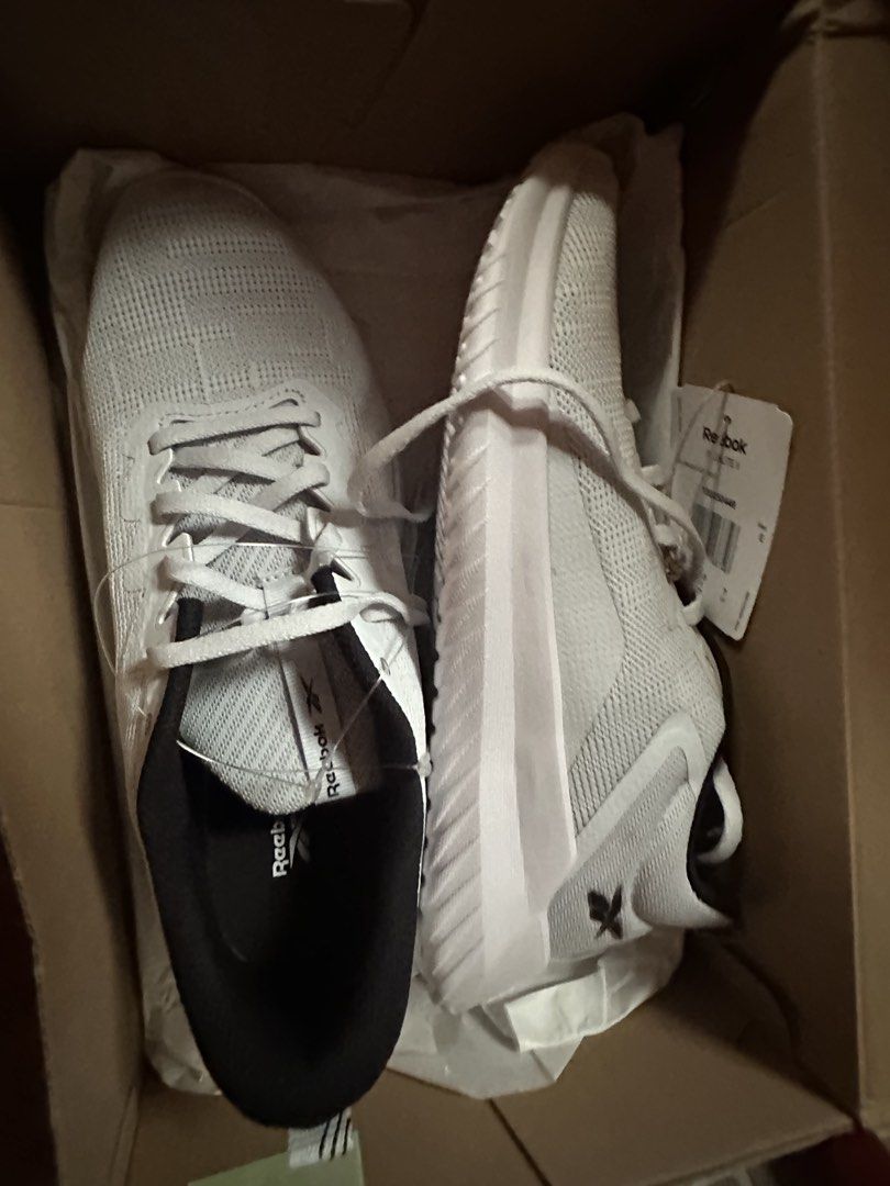 Reebok White Running Shoes (Category: Sneakers) located in Manila. Submitted by majav (Listing ID 1463327766, Image 1). Description: - Brand: Reebok - Color: White - Type: Running Shoes - Size: US 7 (UK 7, EUR 40.5, CM 260) - Condition: Brand new, in original box with tags attached - Features: Lightweight, comfortable - Ideal for: Workouts, everyday wear - Origin: Made in Vietnam.
