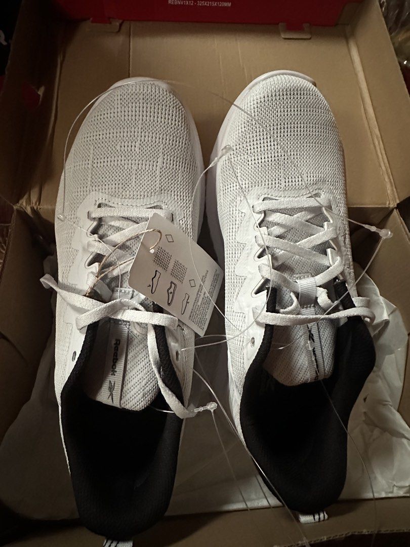 Reebok White Running Shoes (Category: Sneakers) located in Manila. Submitted by majav (Listing ID 1463327766, Image 2). Description: - Brand: Reebok - Color: White - Type: Running Shoes - Size: US 7 (UK 7, EUR 40.5, CM 260) - Condition: Brand new, in original box with tags attached - Features: Lightweight, comfortable - Ideal for: Workouts, everyday wear - Origin: Made in Vietnam.