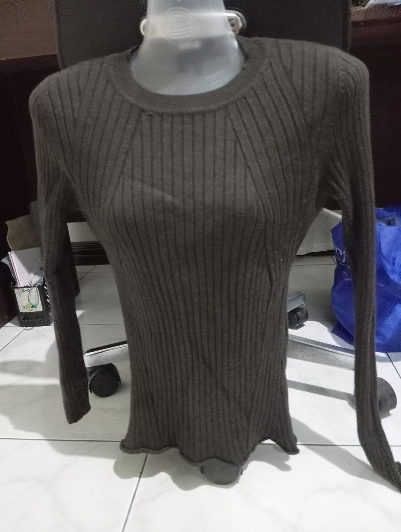 Ribbed Long Sleeve Sweater (Category: Longsleeves) located in Dasmarinas. Submitted by kei05 (Listing ID 1463440273, Image 2). Description: - Dark grey ribbed knit sweater - Long sleeves - Fitted silhouette - Classic crew neck - Slight ruffle detail at the hem - Stretchy and comfortable material - Perfect for layering.