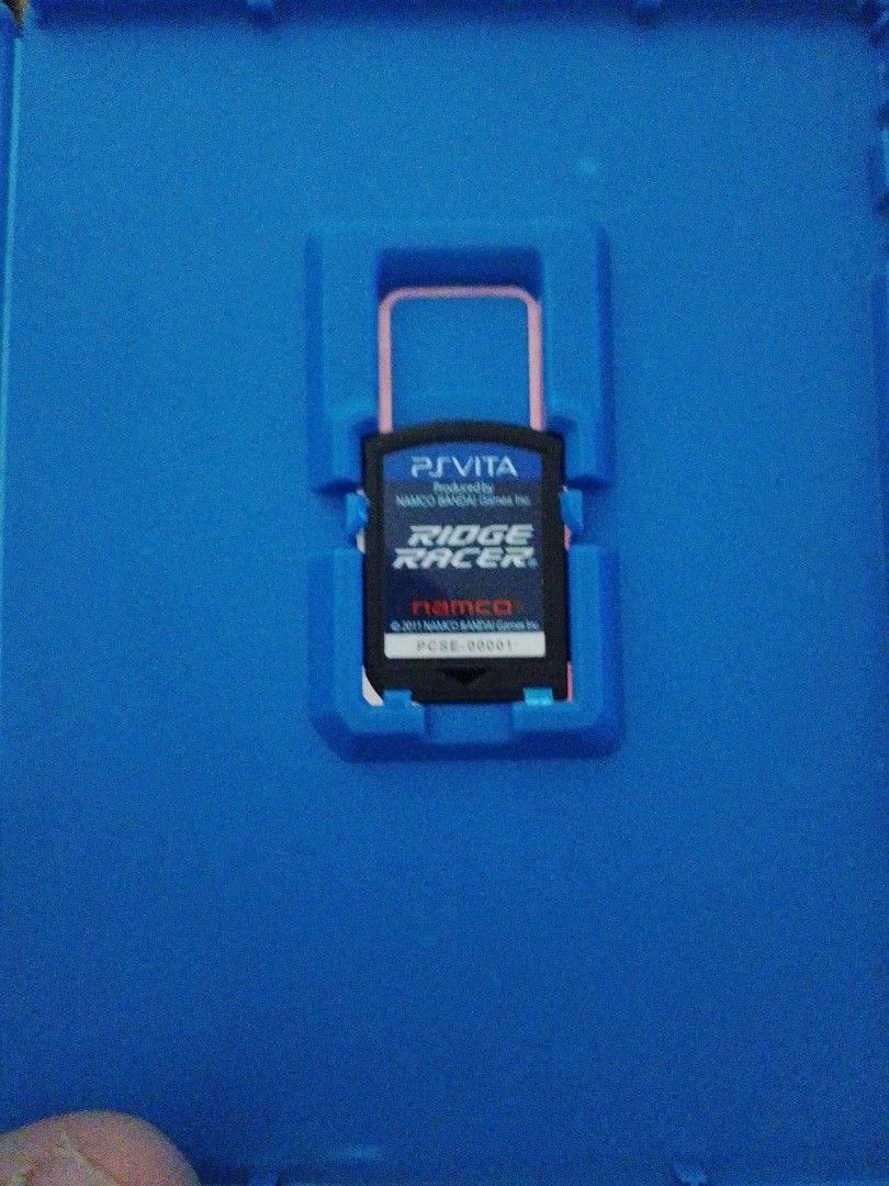 Ridge Racer PS Vita Game (Category: PlayStation) located in Manila. Submitted by coolowl-156047 (Listing ID 1463473045, Image 1). Description: - Ridge Racer game for PS Vita - Comes with original case - Published by Namco Bandai Games - Released in 2011 - A fantastic racing experience for your Vita!.