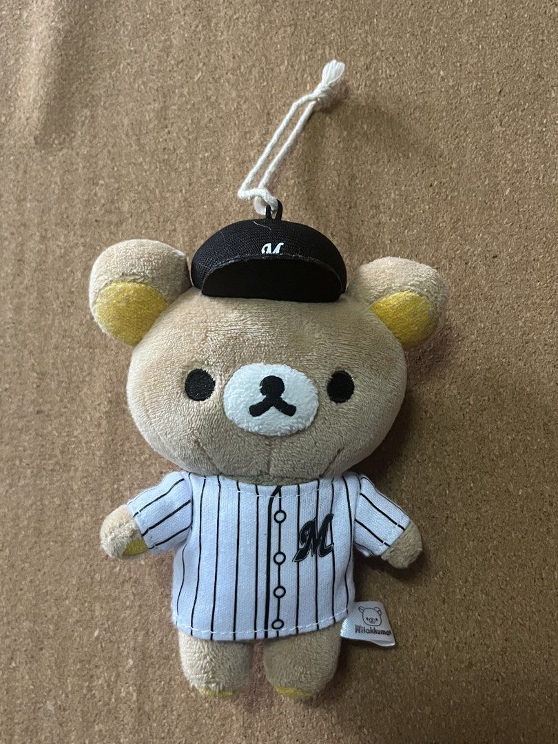 Rilakkuma Baseball Player Plush Toy with Cap (Category: Plushies & Soft Toys) located in Baguio. Submitted by gaara1234 (Listing ID 1463350456, Image 1). Description: - Adorable Rilakkuma plush toy dressed as a baseball player. - Features a classic pinstripe jersey and a black baseball cap with an 'M' logo. - Includes a convenient loop for hanging. - Perfect gift for Rilakkuma and baseball enthusiasts. - Approximately 4-5 inches in height..