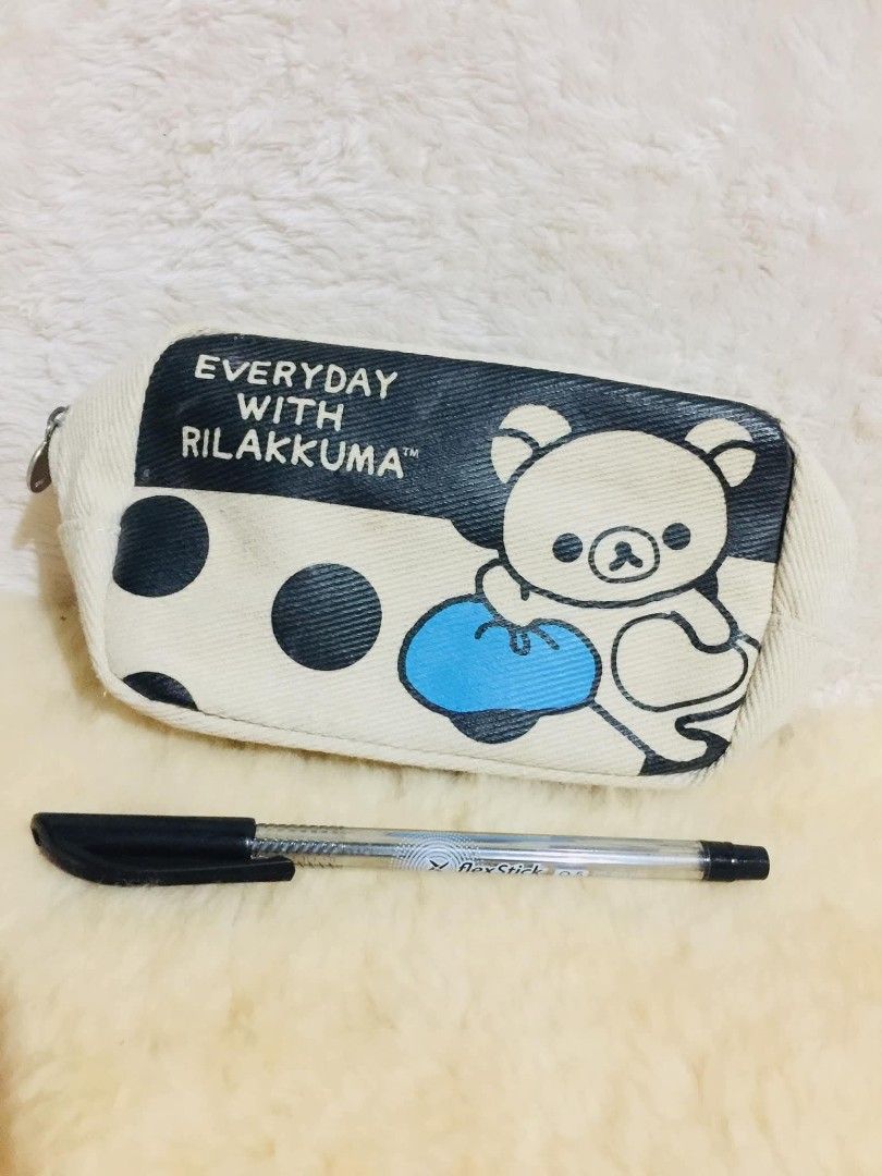 Rilakkuma Everyday With Rilakkuma Pouch (Category: Stationery & School Supplies) located in Baguio. Submitted by izza_thrifty (Listing ID 1463464144, Image 2). Description: - Cute Rilakkuma pouch with polka dots - Cream colored canvas material - Zipper closure with 'R' charm - Ideal for stationery, makeup, or small essentials - Measures approximately 8 inches long - From the 'Everyday With Rilakkuma' collection - Copyright 2018 San-X.