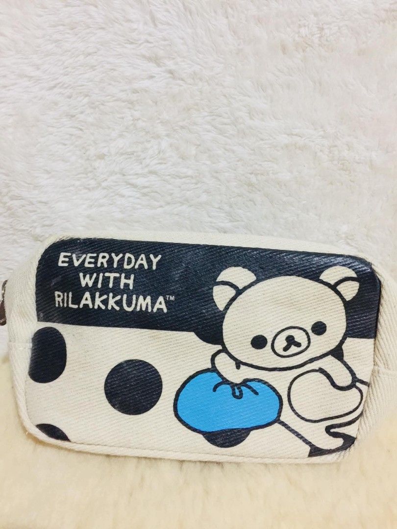 Rilakkuma Everyday With Rilakkuma Pouch (Category: Stationery & School Supplies) located in Baguio. Submitted by izza_thrifty (Listing ID 1463464144, Image 1). Description: - Cute Rilakkuma pouch with polka dots - Cream colored canvas material - Zipper closure with 'R' charm - Ideal for stationery, makeup, or small essentials - Measures approximately 8 inches long - From the 'Everyday With Rilakkuma' collection - Copyright 2018 San-X.