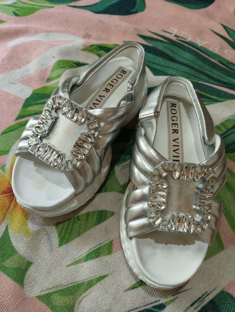 Roger Vivier Silver Crystal Buckle Sandals (Category: Flats & Sandals) located in Davao. Submitted by marissasof29286 (Listing ID 1463331494, Image 1). Description: -Authentic Roger Vivier silver sandals -Iconic crystal buckle detail -Secure and comportable slingback strap -Padded straps and sole for all day comfort -Versatile: dress up or down -Comes with original box -23.5 cm on tape -No issue.