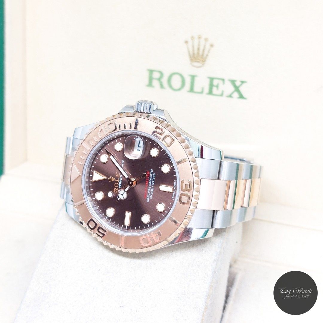 Rolex 37mm 18K Half Rose Gold Chocolate Dial Yachtmaster REF: 268621 (Box, Cert & Green Tag-2018) (Category: Watches) located in Singapore. Submitted by pngwatchdealer (Listing ID 1463537827, Image 2). Description: [SPECIFICATIONS] **Watch comes in full option (Box, Cert & Green Tag)** **Straight bracelet** Brand: Rolex Model: Oyster Perpetual Chocolate Dial 37mm Yachtmaster Date (REF: 268621)(AN)(18)(O) Movement: Automatic (Self-Winding) Functio