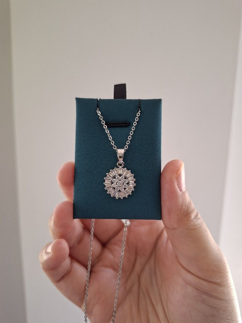 Round Dramatic Silver Pendant and White Crystals Silver Necklace (Category: Necklaces) located in Dasmarinas. Submitted by danabrie22 (Listing ID 1463397181, Image 2). Description: brand new - stainless steel - cubic zirconia stones 18 inches chain lobster type lock 10/10 condition from Hongkong.