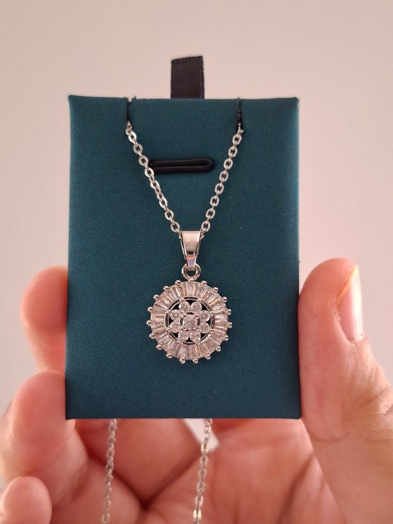 Round Dramatic Silver Pendant and White Crystals Silver Necklace (Category: Necklaces) located in Dasmarinas. Submitted by danabrie22 (Listing ID 1463397181, Image 1). Description: brand new - stainless steel - cubic zirconia stones 18 inches chain lobster type lock 10/10 condition from Hongkong.