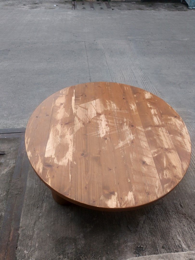 Round Wooden Coffee Table (Category: Tables & Sets) located in Valenzuela. Submitted by kendra071914 (Listing ID 1463463995, Image 2). Description: - Round wooden coffee table - Made of solid wood - Surface wear and tear visible (as pictured) - Sturdy legs - Ideal for living rooms or lounge areas - Ready for a new home.