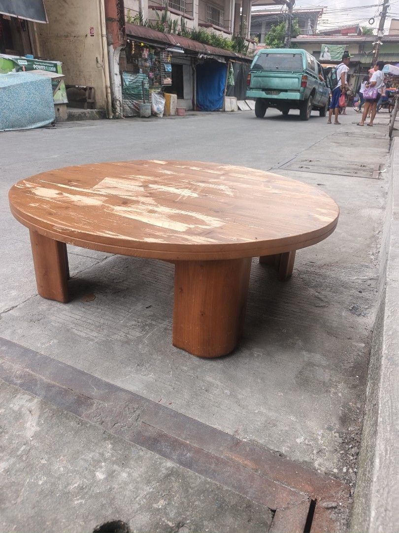 Round Wooden Coffee Table (Category: Tables & Sets) located in Valenzuela. Submitted by kendra071914 (Listing ID 1463463995, Image 3). Description: - Round wooden coffee table - Made of solid wood - Surface wear and tear visible (as pictured) - Sturdy legs - Ideal for living rooms or lounge areas - Ready for a new home.