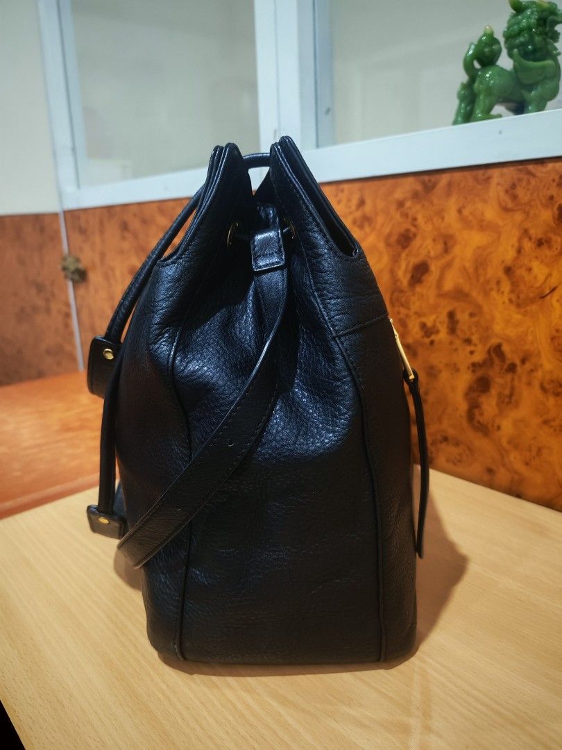 Salad Leather Tote Bag with Charm (Category: Tote Bags) located in Manila. Submitted by jeraldliam77253 (Listing ID 1463355800, Image 2). Description: - Brand: Salad - Material: Black Leather - Texture: Pebbled - Exterior: Front zip pocket - Hardware: Gold details - Accent: 'Jerome Sarto' gold charm - Interior: Spacious - Use: Great everyday bag.