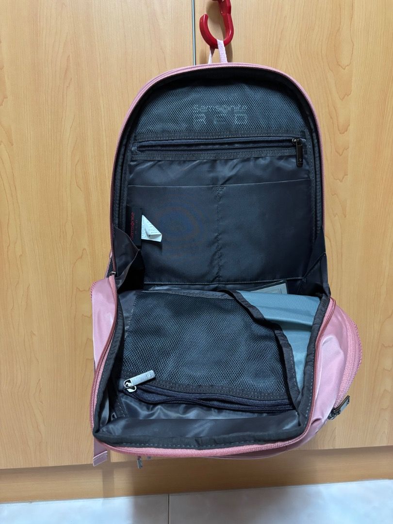 Samsonite backpack (Category: Backpacks) located in Singapore. Submitted by ma23456 (Listing ID 1463529967, Image 3). Description: As good as new. Used 2-3 times. Lots of compartments. Photo lighting has lead to like as if it’s different colors. It’s the light pink color Self collect.