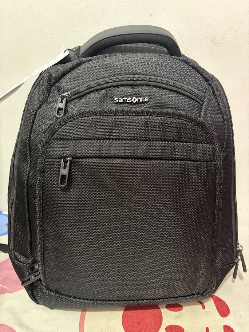 Samsonite Black Laptop Backpack (Category: Backpacks) located in Pasig City. Submitted by antonyeeeta (Listing ID 1463358518, Image 2). Description: - Brand new Samsonite backpack with tags still attached - Classic black color - Multiple compartments for excellent organization - Padded shoulder straps for maximum comfort - Ideal for carrying laptops and everyday essentials.