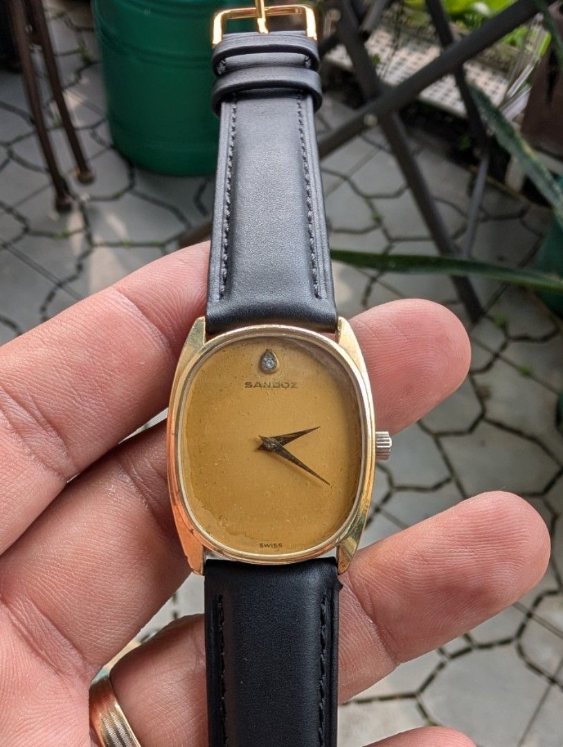 Sandoz Men's Watch (Category: Men's Watches) located in Makati City. Submitted by greatbuysmnl (Listing ID 1463385010, Image 1). Description: Brand: Sandoz Type: Men's Watch Case and Dial: Gold-tone Gold-plated Swiss Made 35mm x 31mm with crown 17 Jewels incabloc with diamond marker at 12 in good working condition .