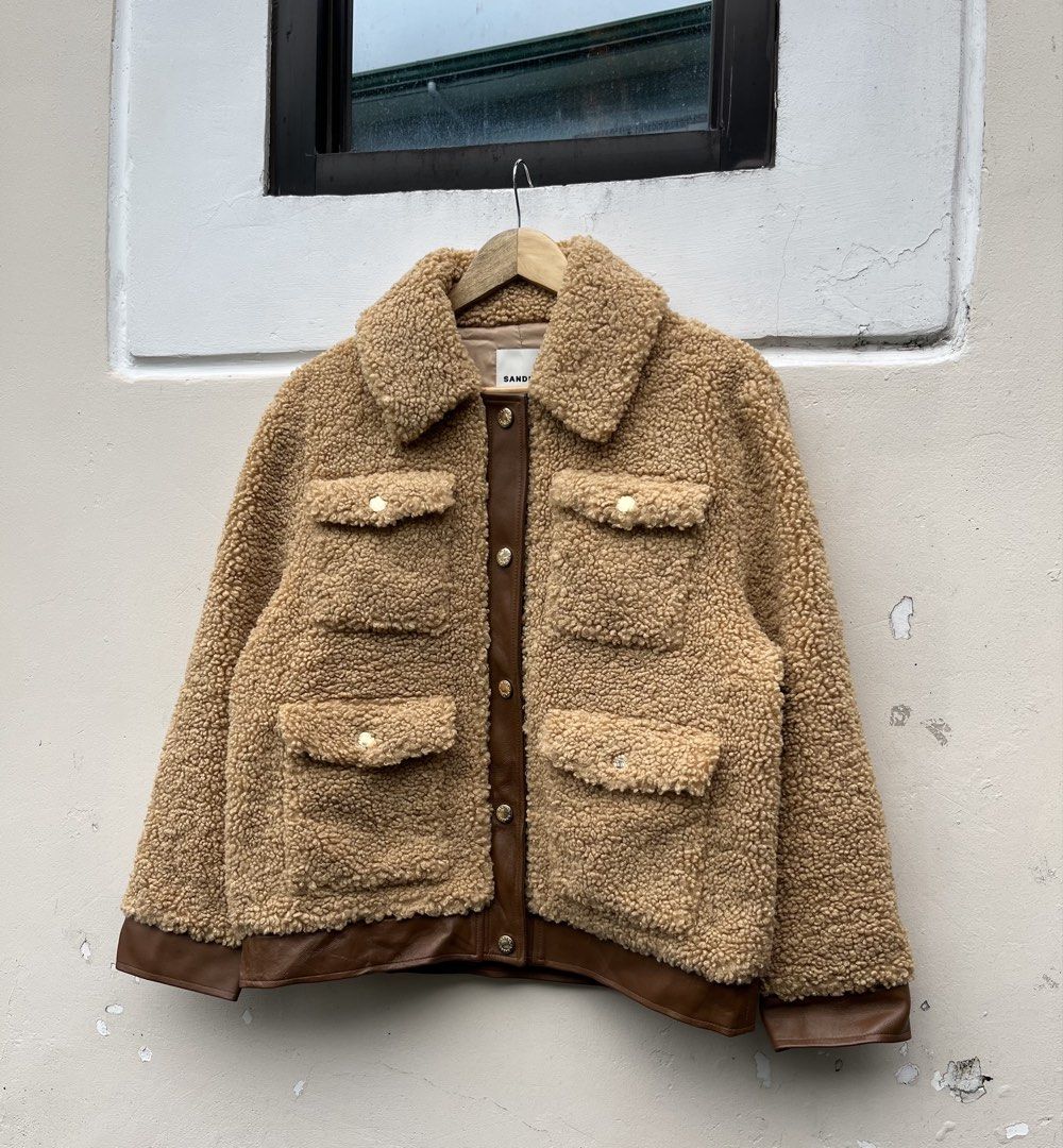 SANDRO LEATHER TRIMMED FAUX SHERLING JACKET (Category: Luxury Apparel) located in Baguio. Submitted by closetgc.clothingshop (Listing ID 1463401078, Image 3). Description: Sandro leather trimmered faux shearling jacket Best fit medium Guaranteed authentic In excellent condition ( 9.8 / 10 ) .