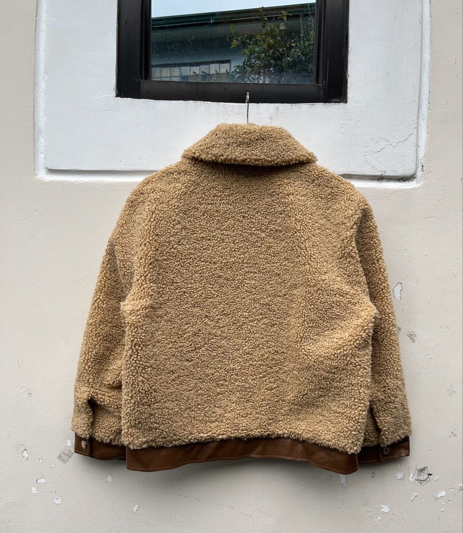 SANDRO LEATHER TRIMMED FAUX SHERLING JACKET (Category: Luxury Apparel) located in Baguio. Submitted by closetgc.clothingshop (Listing ID 1463401078, Image 2). Description: Sandro leather trimmered faux shearling jacket Best fit medium Guaranteed authentic In excellent condition ( 9.8 / 10 ) .