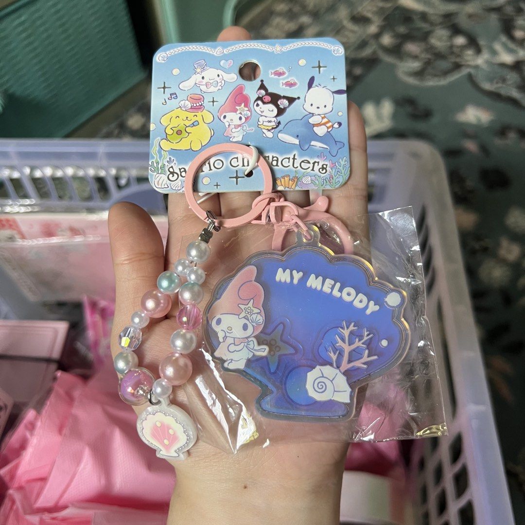 Sanrio Characters My Melody Shell Keychain Charm (Category: Character Goods) located in Quezon City. Submitted by mei_declutters (Listing ID 1463405136, Image 1). Description: - Adorable My Melody keychain - Unique shell design with pearlescent finish - Features a beaded strap with a small shell charm - Ideal accessory for bags and keys - Part of the official Sanrio characters collection.