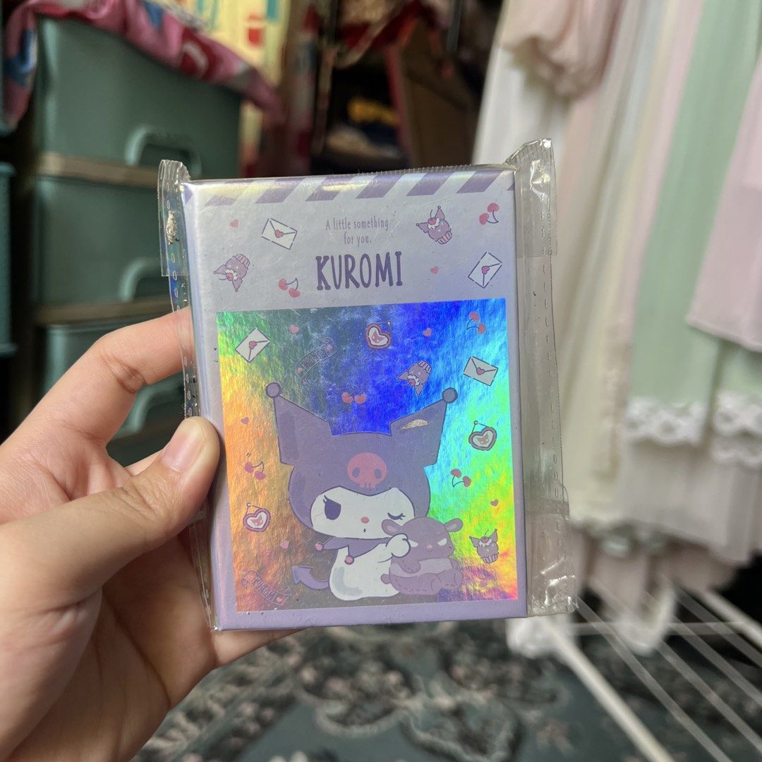 Sanrio Kuromi Holographic Mini Notebook (Category: Stationery & School Supplies) located in Quezon City. Submitted by mei_declutters (Listing ID 1463402867, Image 1). Description: - Adorable Kuromi mini notebook and sticker set - Features a cool holographic design - Perfect for journaling, note-taking, or decorating your belongings - A fantastic gift for any Sanrio enthusiast.