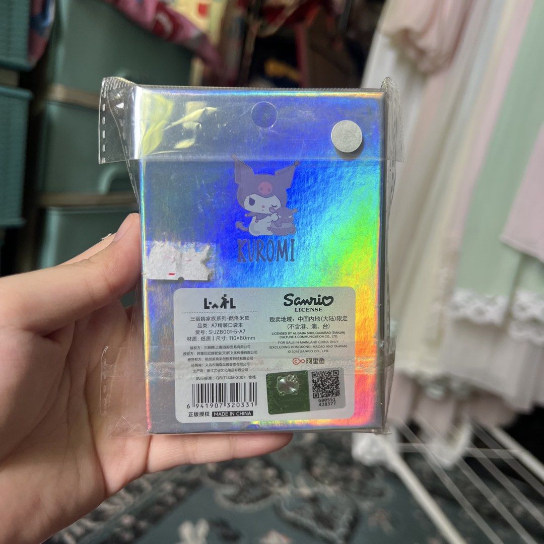 Sanrio Kuromi Holographic Mini Notebook (Category: Stationery & School Supplies) located in Quezon City. Submitted by mei_declutters (Listing ID 1463402867, Image 2). Description: - Adorable Kuromi mini notebook and sticker set - Features a cool holographic design - Perfect for journaling, note-taking, or decorating your belongings - A fantastic gift for any Sanrio enthusiast.