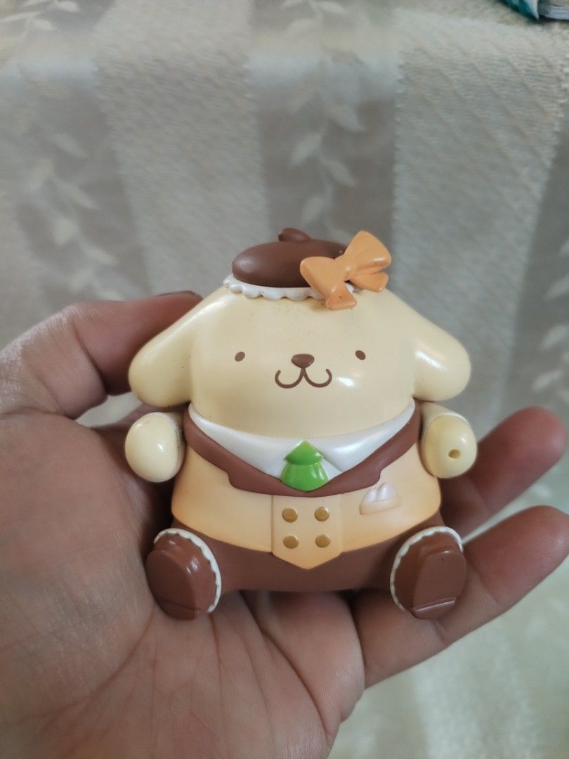 Sanrio Pompompurin Figure 2025 (Category: Figurines & Statues) located in Manila. Submitted by malditas (Listing ID 1463552299, Image 1). Description: - Adorable Pompompurin figure, approximately 4 inches tall. - Dressed in a stylish hat and jacket. - Features a cute little green tree design on the shirt. - Minor marks on the back, visible in photos. - A must-have collectible for any Sanrio fan! From HT box BUY AS IS (NO RETURN, NO EXCHANGE, NO R