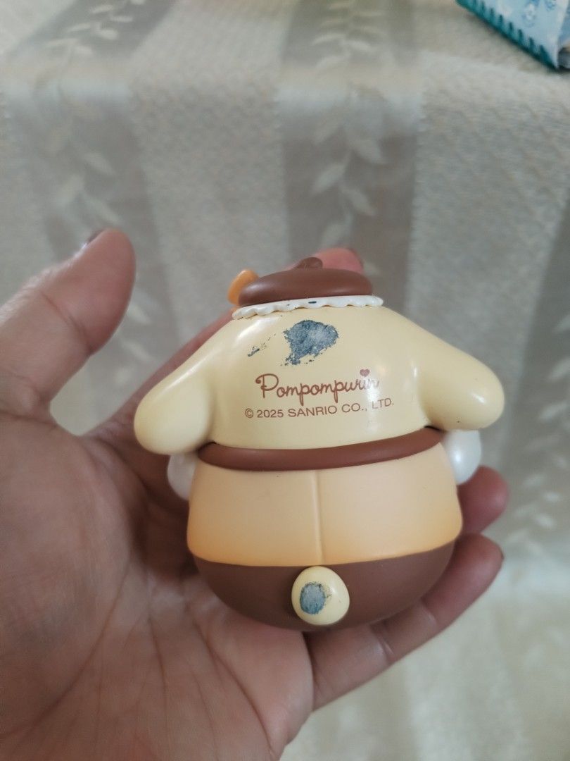 Sanrio Pompompurin Figure 2025 (Category: Figurines & Statues) located in Manila. Submitted by malditas (Listing ID 1463552299, Image 2). Description: - Adorable Pompompurin figure, approximately 4 inches tall. - Dressed in a stylish hat and jacket. - Features a cute little green tree design on the shirt. - Minor marks on the back, visible in photos. - A must-have collectible for any Sanrio fan! From HT box BUY AS IS (NO RETURN, NO EXCHANGE, NO R